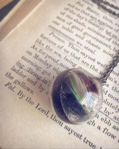 Glass Globe Necklace with Black and Green Feather